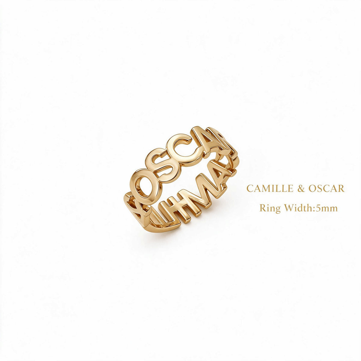 Angled view of a gold-tone cutout name loop ring showing the names Camille and Oscar and a 5 mm width label.