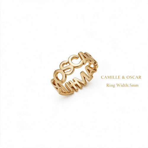 Angled view of a gold-tone cutout name loop ring showing the names Camille and Oscar and a 5 mm width label.
