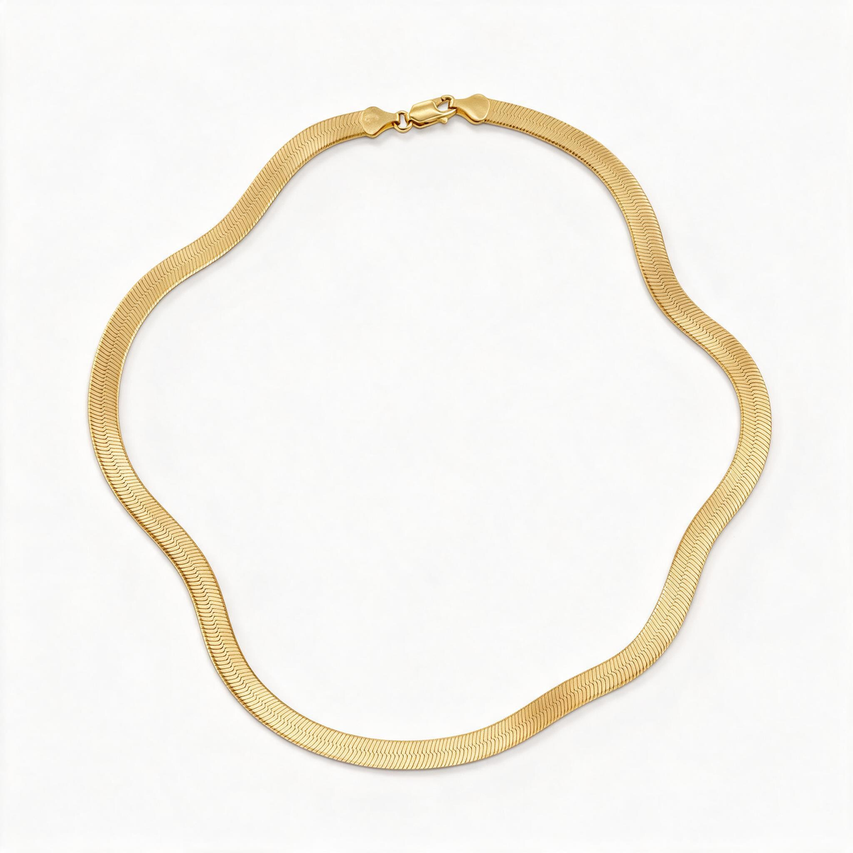 Flat gold-tone herringbone necklace laid in a curve to show the full chain and clasp.