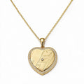 Gold-tone heart pendant necklace with a map design and a sparkling border
