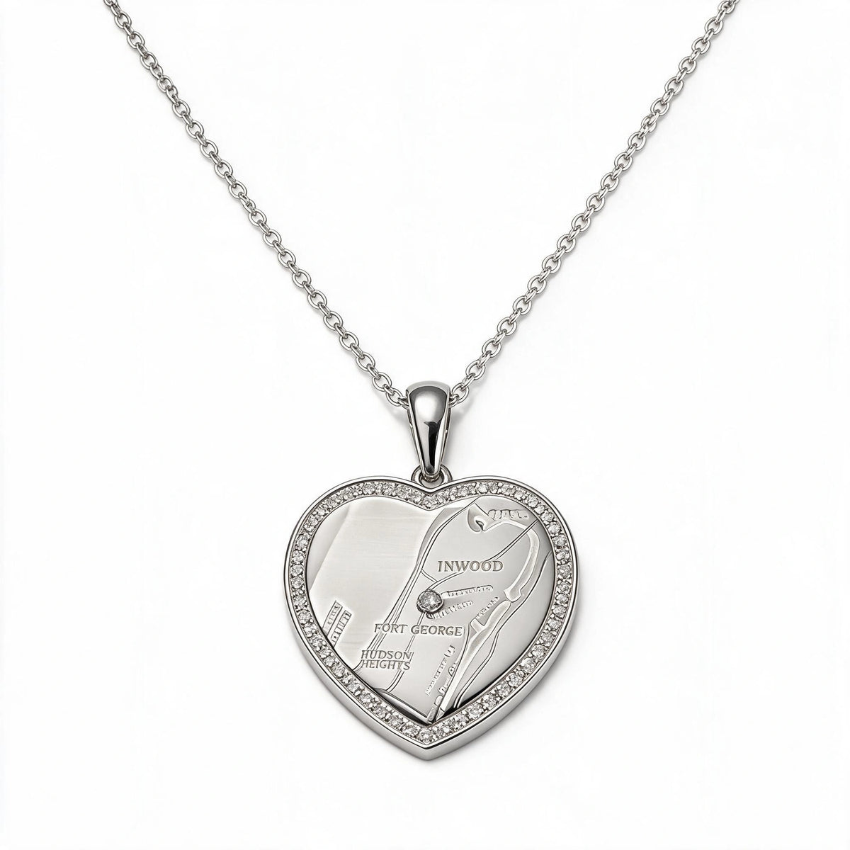 Silver-tone heart pendant necklace with a map design and a sparkling border