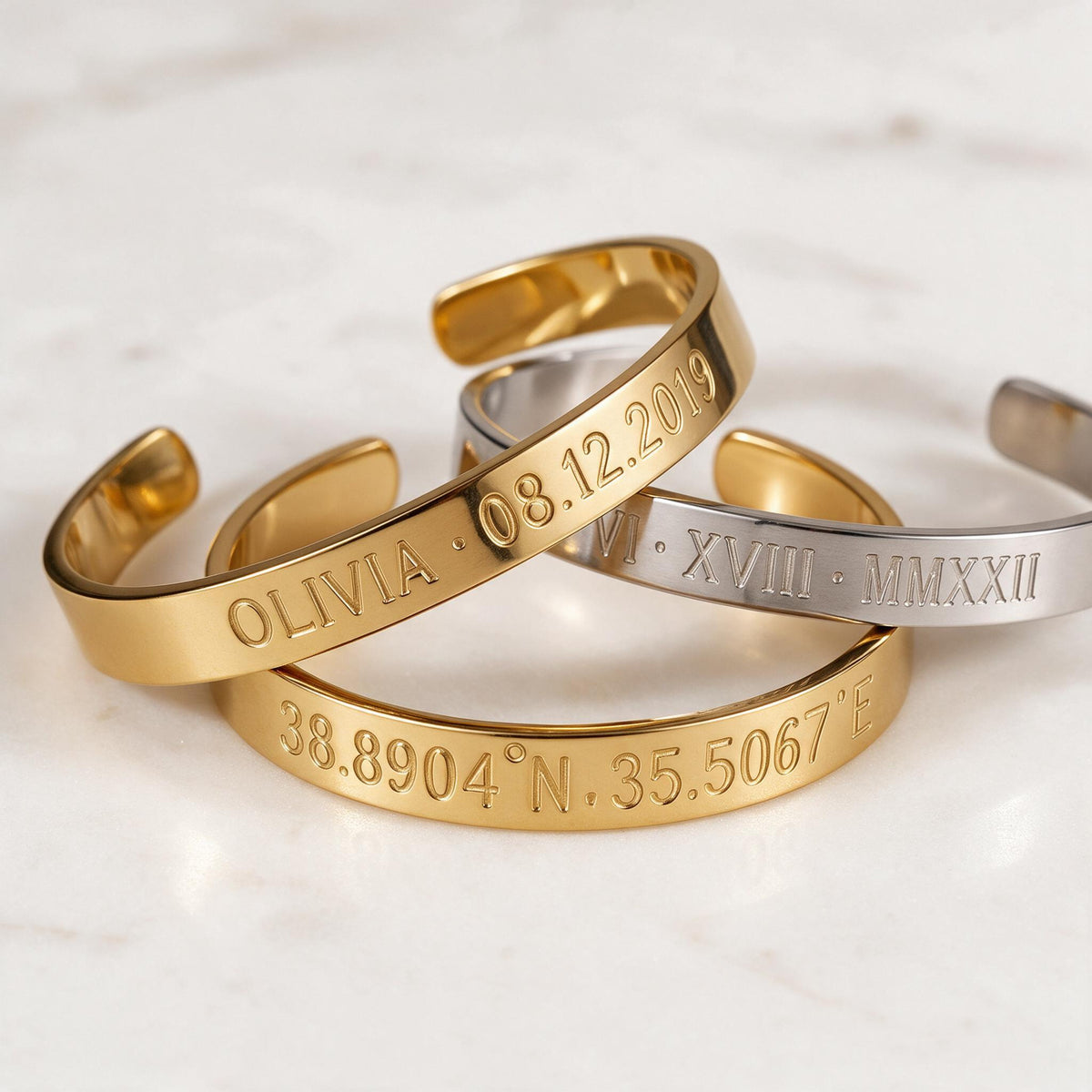 Personalized engraved cuff bracelets with names, dates, coordinates and Roman numerals